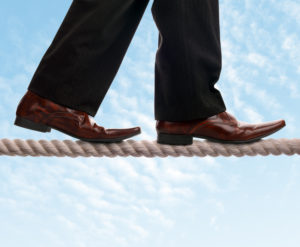 Walking a high-wire in business.