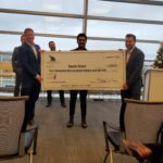 Aaron Bravo accepting his $2,500 grand prize.