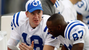 Manning and Wayne reviewing plays.