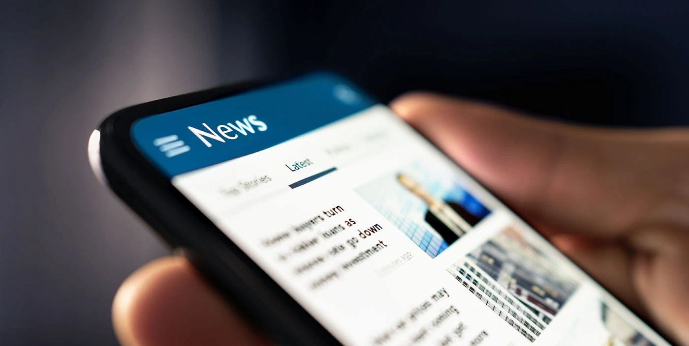 Close Up Photo Of News On A Smartphone