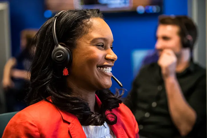 Lady Wearing A Headset Smiling