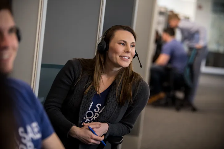 Woman With Headset Outside A Cubicle Tilted