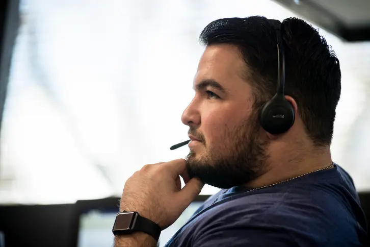 Pondering Man Wearing Headset
